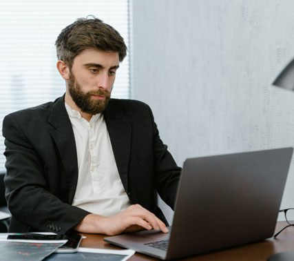 Focused student working on a laptop